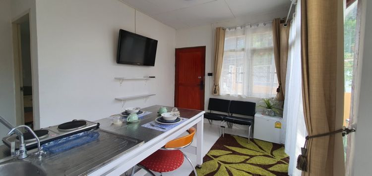 Private suite, 1 bedroom, 1 bathroom with living room and kitchen counter in a single-storey house.